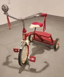 Vintage Radio Flyer Dual Deck Tricycle Red With Bell And Streamers. Fixed Price $110.00.