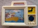 1986 Vintage Unimax Kids Wind-up Tv Clock Radio Toy Music Box W/ Motion. Fixed Price $25.00.